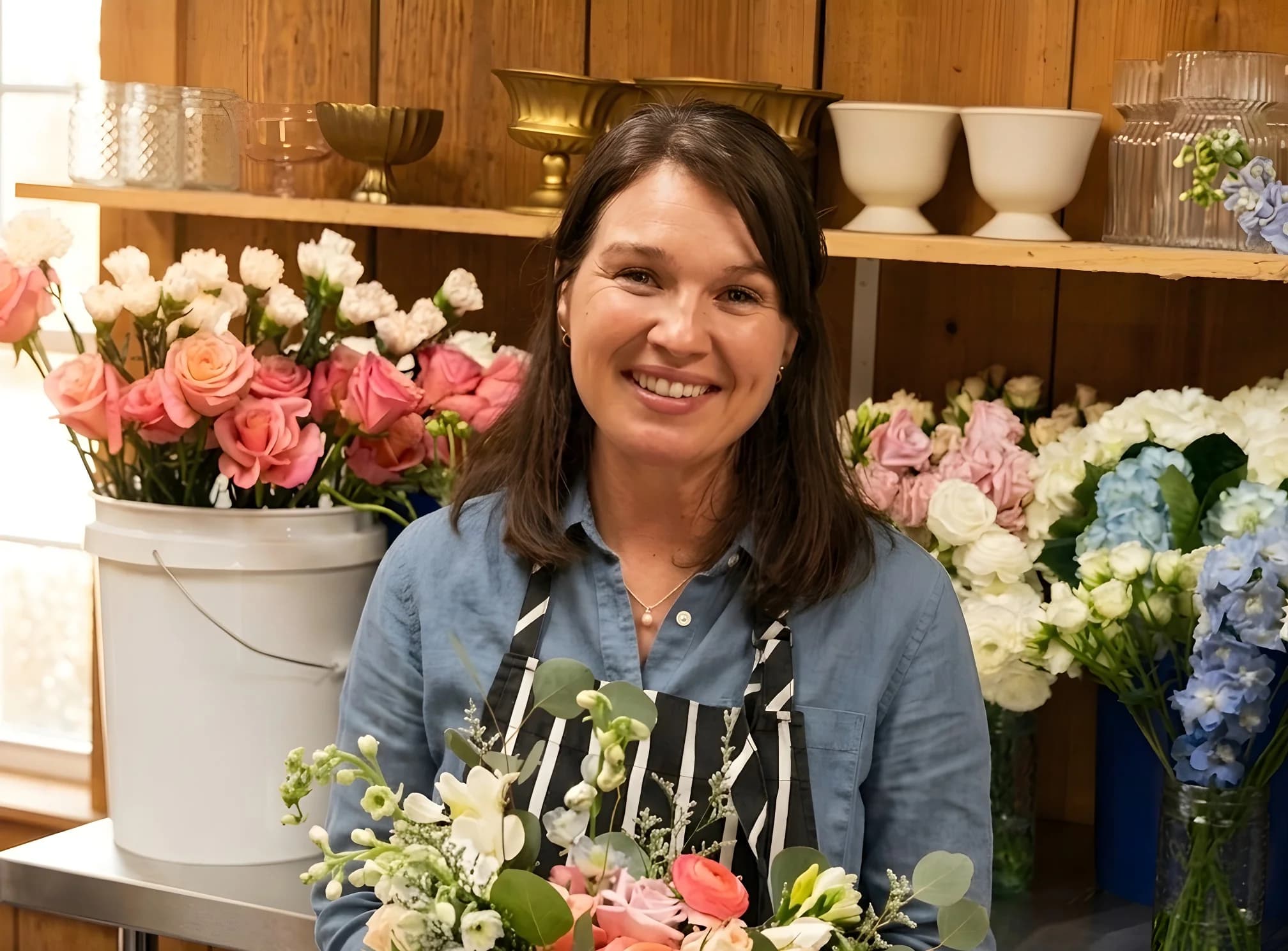 Bride holding a Heather Florals bouquet